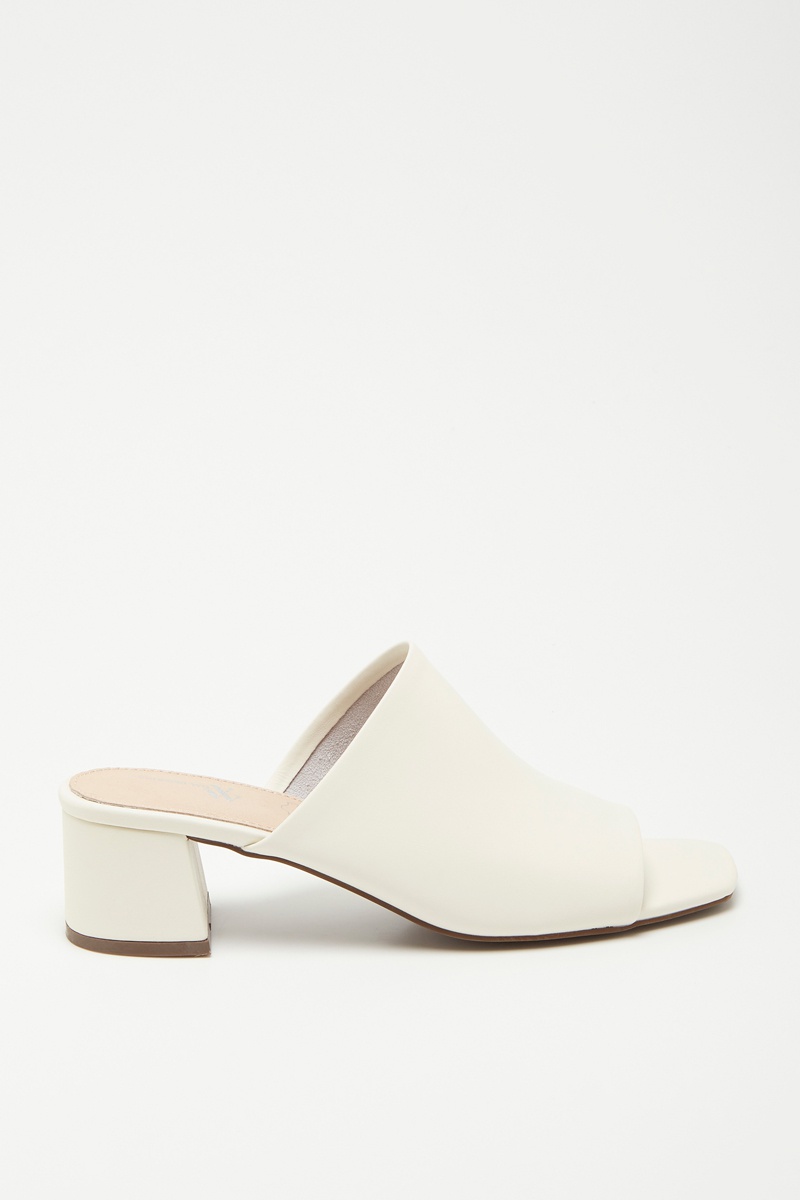 Mules à talons en cuir Beige